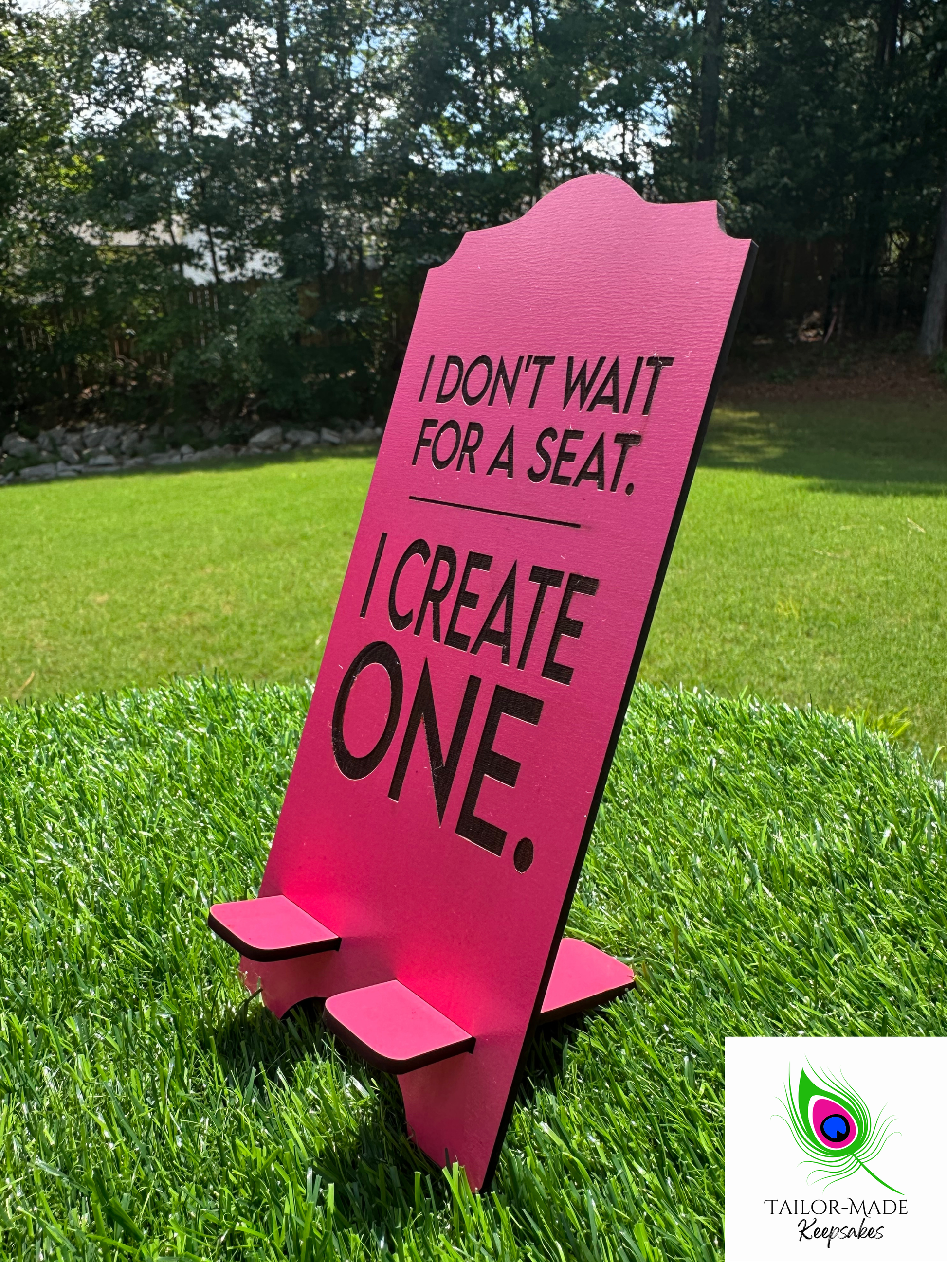 Pink I Don't Wait For A Seat laser engraved statement phone stand outdoors, motivational desk decor close-up